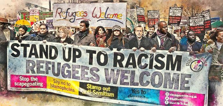 Protesters holding Stand up to Racism sign